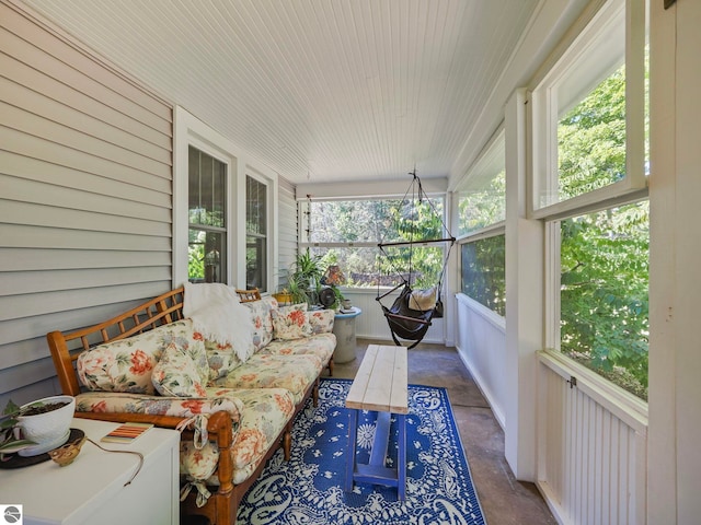sunroom featuring an outdoor living space