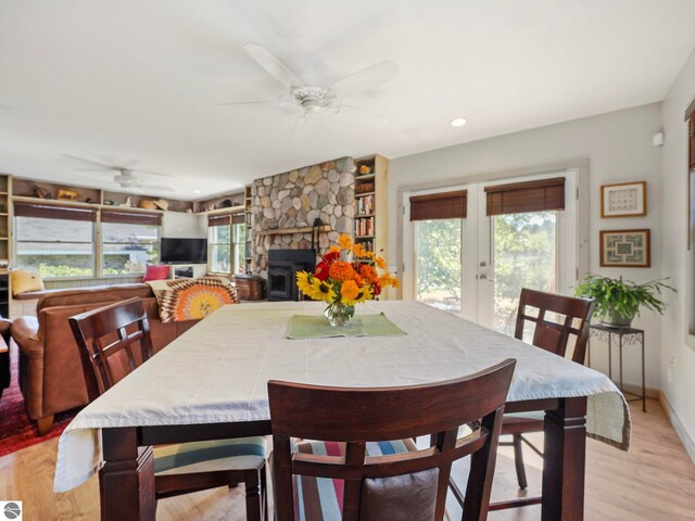 dining space with light wood-style floors, a ceiling fan, recessed lighting, french doors, and baseboards