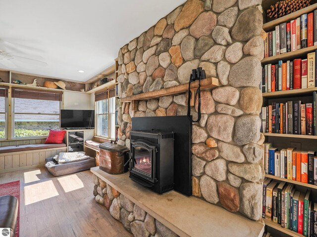 interior space with wood finished floors and a ceiling fan