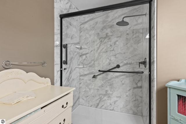 full bathroom featuring a marble finish shower