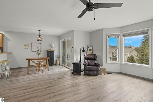 sitting room with light wood-style floors and baseboards