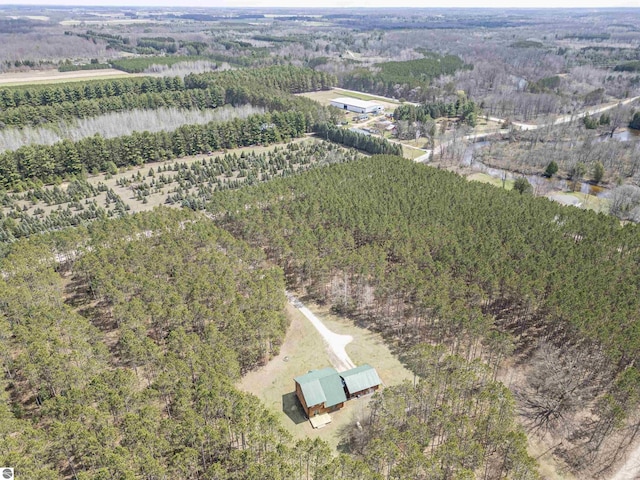 aerial view with a rural view and a wooded view