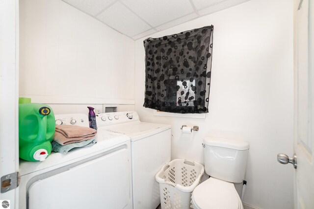 laundry room featuring separate washer and dryer and laundry area