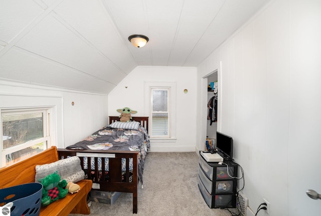 bedroom with carpet flooring and vaulted ceiling