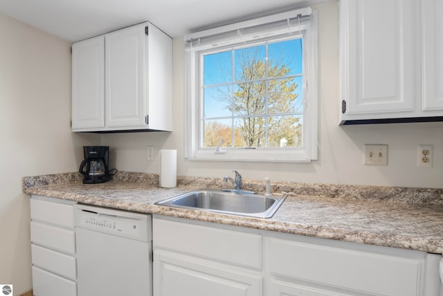 5000 Townhouse Dr, Cedar, MI 49621 - kitchen featuring a sink, white cabinetry, and white dishwasher