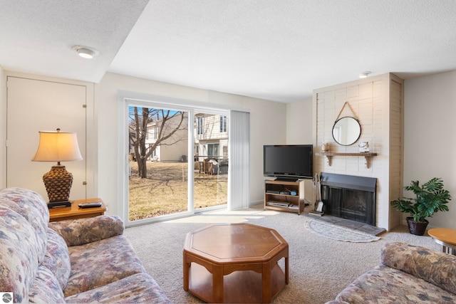 5000 Townhouse Dr, Cedar, MI 49621 - living room featuring a textured ceiling, carpet flooring, and a fireplace