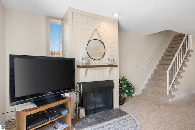 5000 Townhouse Dr, Cedar, MI 49621 - carpeted living room with baseboards and stairway
