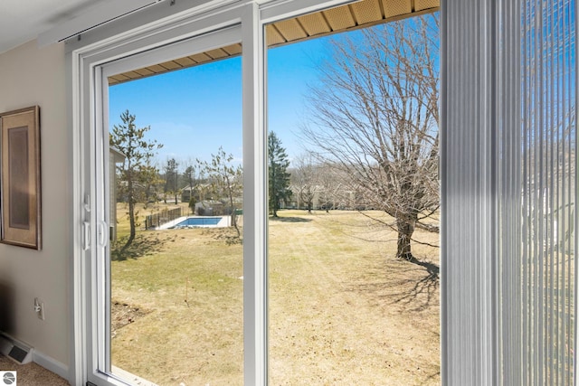 5000 Townhouse Dr, Cedar, MI 49621 - doorway to outside with visible vents and baseboards