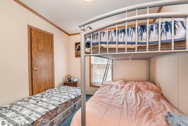 carpeted bedroom featuring crown molding