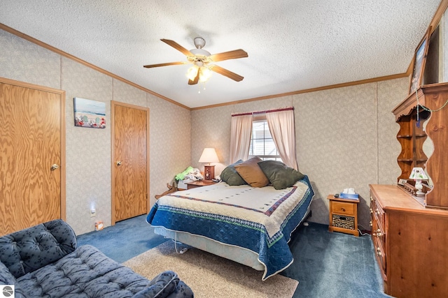 bedroom with crown molding, ceiling fan, a textured ceiling, wallpapered walls, and dark colored carpet