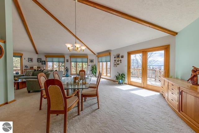 dining space with light carpet, a textured ceiling, a chandelier, and lofted ceiling with beams