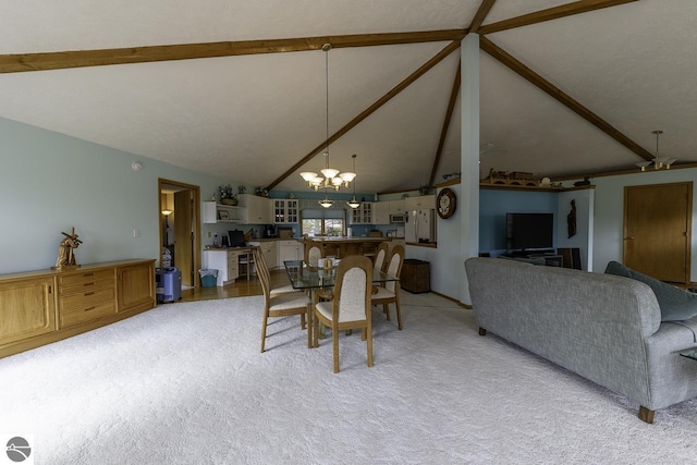 dining area with a chandelier, light colored carpet, and vaulted ceiling with beams