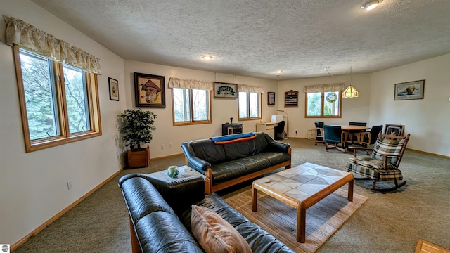 living room with recessed lighting, carpet, a textured ceiling, and baseboards