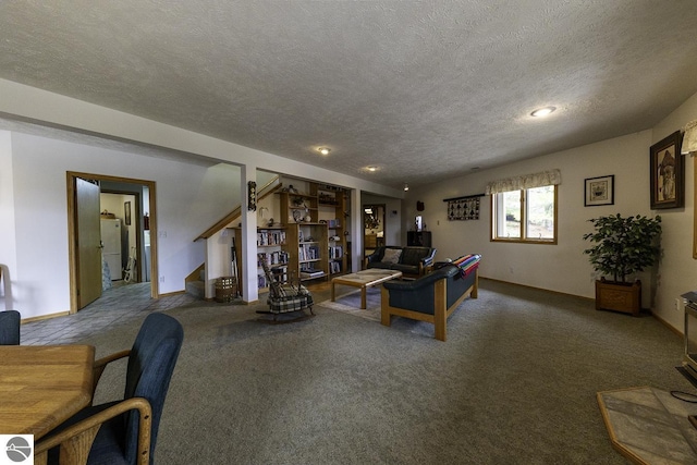 living room with a textured ceiling, carpet flooring, and stairway