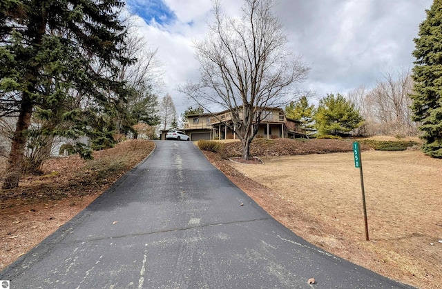 view of road with aphalt driveway