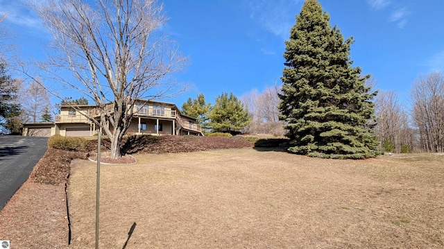 view of front of house with a garage and aphalt driveway