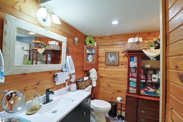 2587 S Coldwater Rd, Mount Pleasant, MI 48858 - full bath featuring toilet, wood walls, and vanity