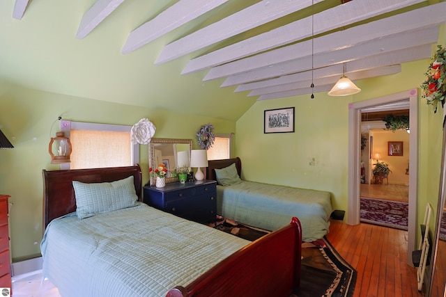 2587 S Coldwater Rd, Mount Pleasant, MI 48858 - bedroom with wood-type flooring and lofted ceiling with beams
