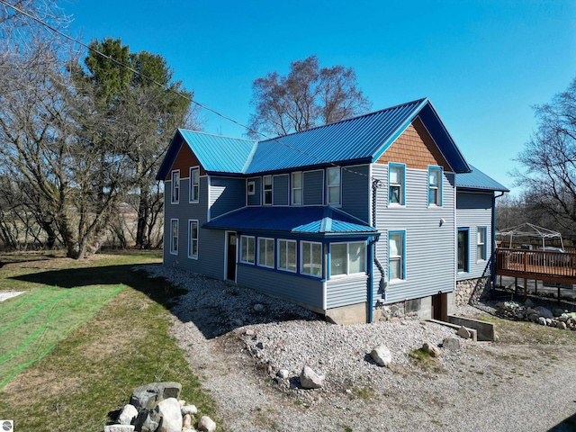 2587 S Coldwater Rd, Mount Pleasant, MI 48858 - exterior space featuring a yard and metal roof