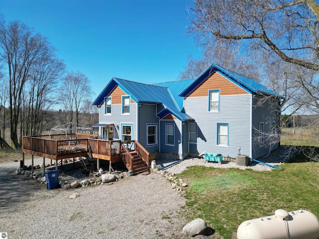 2587 S Coldwater Rd, Mount Pleasant, MI 48858 - back of house featuring a yard and a wooden deck