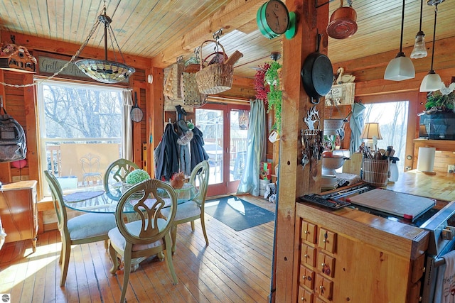 2587 S Coldwater Rd, Mount Pleasant, MI 48858 - dining space featuring wood ceiling, hardwood / wood-style floors, and plenty of natural light