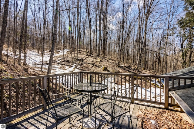 wooden deck with outdoor dining space