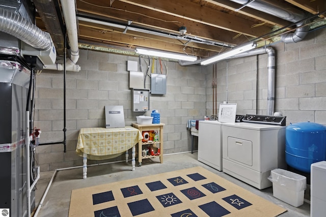 unfinished below grade area with electric panel and washing machine and dryer