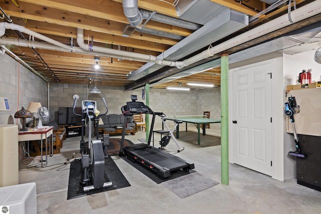 exercise area with concrete block wall