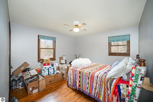 4631 Cardinal Dr, Mount Pleasant, MI 48858 - bedroom featuring wood finished floors and ceiling fan