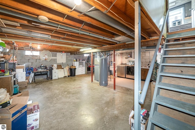 4631 Cardinal Dr, Mount Pleasant, MI 48858 - below grade area featuring water heater, stairway, and separate washer and dryer