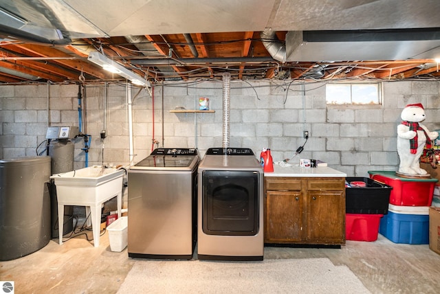 4631 Cardinal Dr, Mount Pleasant, MI 48858 - clothes washing area featuring cabinet space and washing machine and dryer