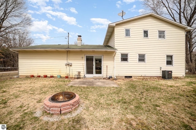 4631 Cardinal Dr, Mount Pleasant, MI 48858 - back of property with central AC, a yard, an outdoor fire pit, a patio area, and fence