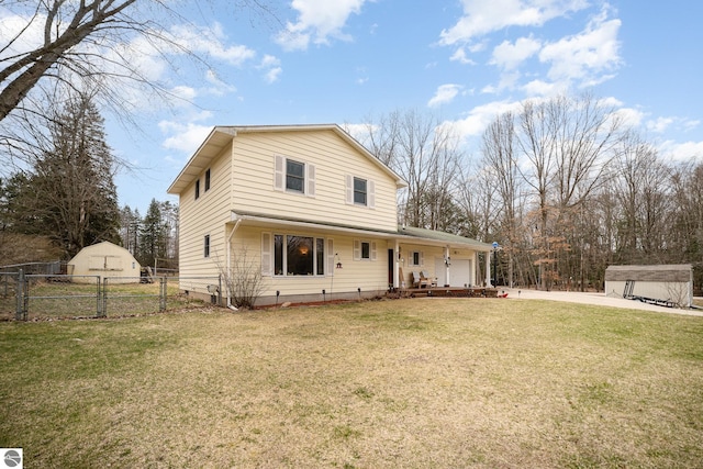 4631 Cardinal Dr, Mount Pleasant, MI 48858 - view of front facade with fence, driveway, an attached garage, a front lawn, and a gate