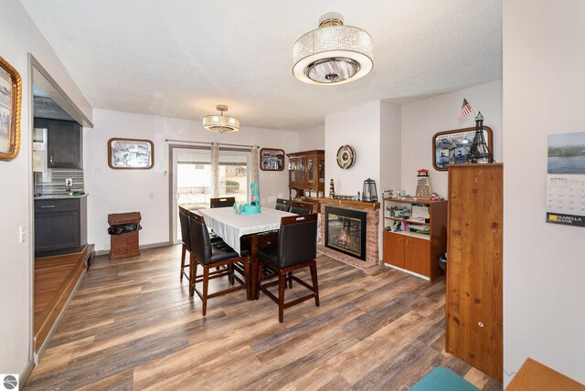 4631 Cardinal Dr, Mount Pleasant, MI 48858 - dining area featuring wood finished floors and a textured ceiling