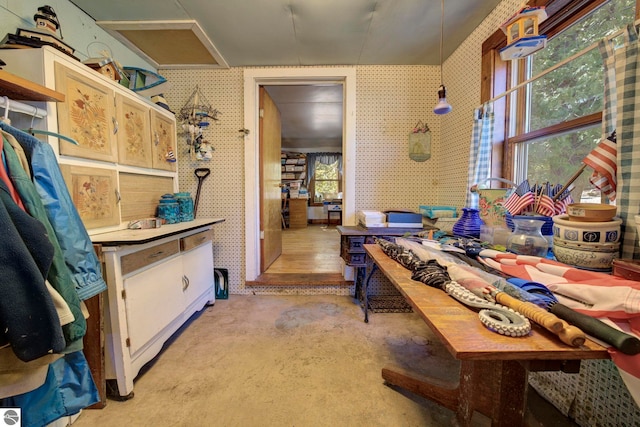 interior space featuring wallpapered walls