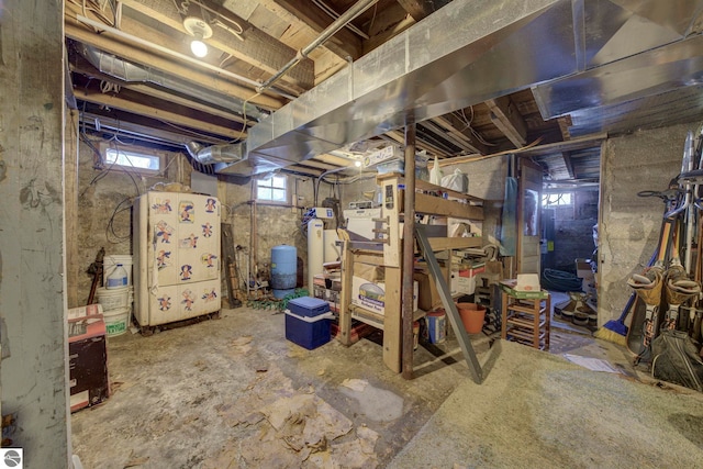 below grade area with freestanding refrigerator