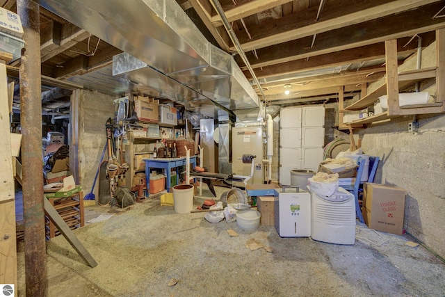 unfinished basement featuring heating unit