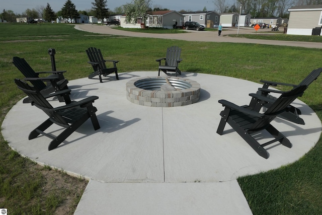 1279 Beacon Hill Ct, Mount Pleasant, MI 48858 - view of patio featuring an outdoor fire pit and a residential view