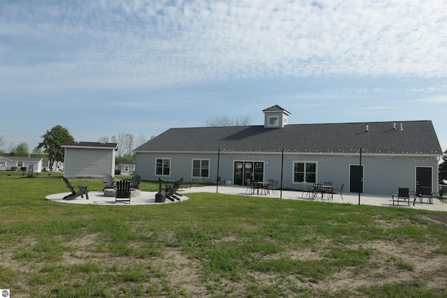 1279 Beacon Hill Ct, Mount Pleasant, MI 48858 - back of house with a patio area and a lawn