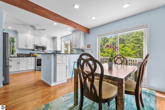 2127 E Timberlane Dr, Traverse City, MI 49686 - kitchen with a healthy amount of sunlight, light wood-style floors, and stainless steel appliances