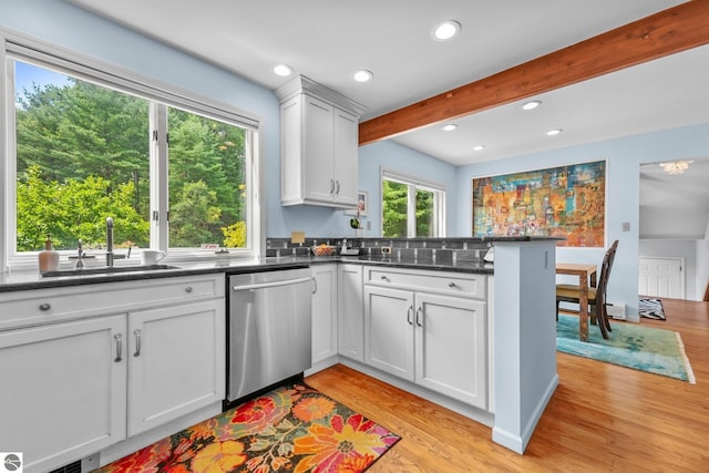 2127 E Timberlane Dr, Traverse City, MI 49686 - kitchen featuring light wood finished floors, dishwasher, a sink, and beam ceiling