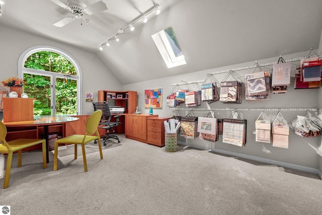 2127 E Timberlane Dr, Traverse City, MI 49686 - home office with ceiling fan, rail lighting, lofted ceiling with skylight, and light carpet