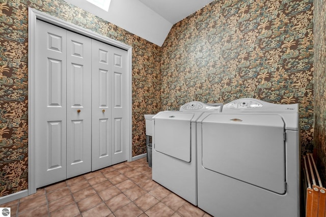 2127 E Timberlane Dr, Traverse City, MI 49686 - clothes washing area featuring laundry area, light tile patterned floors, independent washer and dryer, wallpapered walls, and baseboards