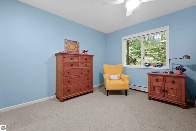 2127 E Timberlane Dr, Traverse City, MI 49686 - living area with light carpet, baseboards, a baseboard heating unit, and a ceiling fan