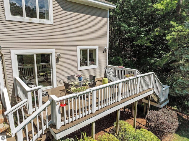 2127 E Timberlane Dr, Traverse City, MI 49686 - wooden terrace with outdoor dining space