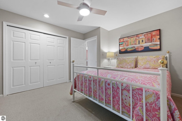 2127 E Timberlane Dr, Traverse City, MI 49686 - bedroom with carpet floors, baseboards, a ceiling fan, and a closet