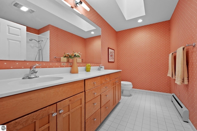 2127 E Timberlane Dr, Traverse City, MI 49686 - bathroom with visible vents, baseboard heating, a skylight, a sink, and tile patterned floors