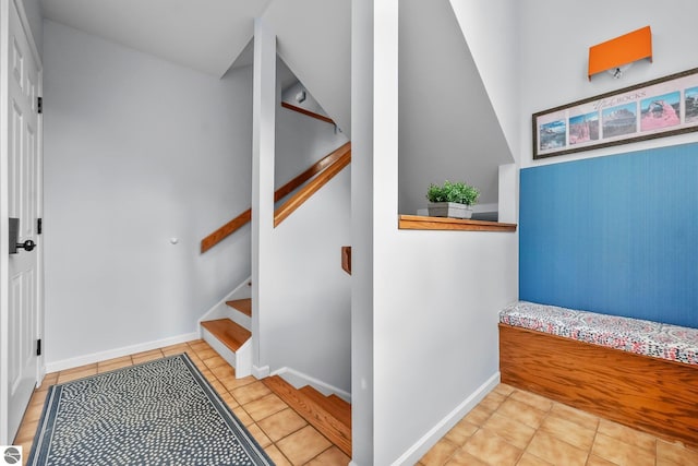 2127 E Timberlane Dr, Traverse City, MI 49686 - stairs with baseboards and tile patterned flooring