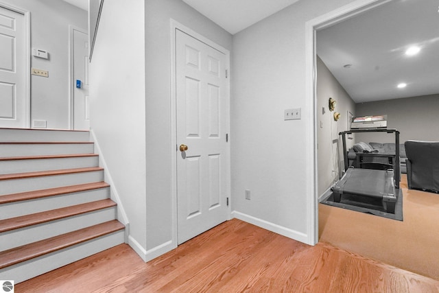 2127 E Timberlane Dr, Traverse City, MI 49686 - staircase with wood finished floors, baseboards, and recessed lighting
