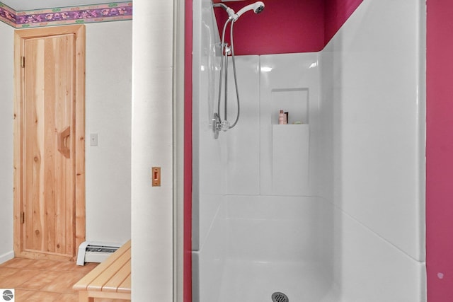 2127 E Timberlane Dr, Traverse City, MI 49686 - bathroom with a stall shower, baseboards, and a baseboard radiator